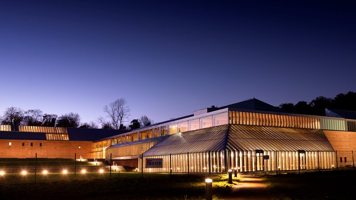 Image of the Burrell Collection lit up at night time